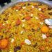Arròs de la Ribera del Xúquer, una paella con kaki creada por dos restaurantes de Llombai